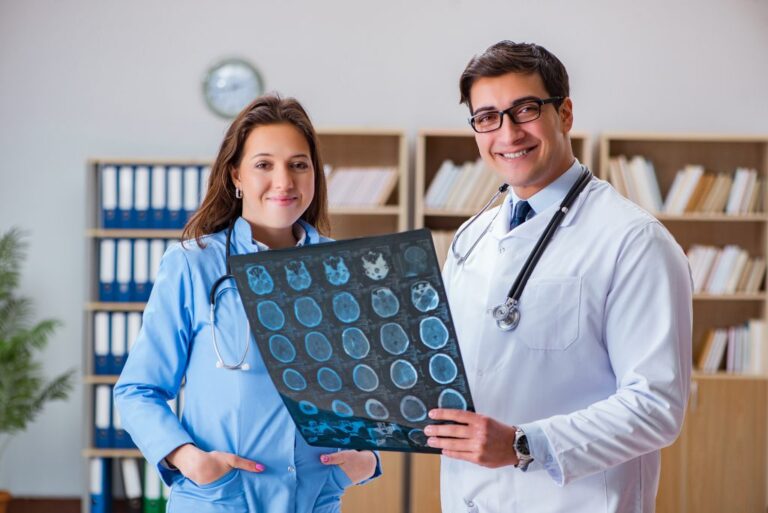 Young doctor looking at computer tomography x-ray image